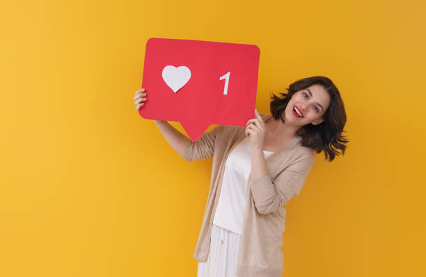 istock woman with like icon 1360009789