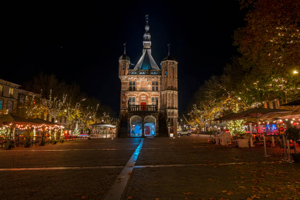 City scenic from Deventer at night in christmas time in the Netherlands City scenic from Deventer at night in christmas time  with The Waag in the Netherlands deventer photos stock pictures, royalty-free photos & images