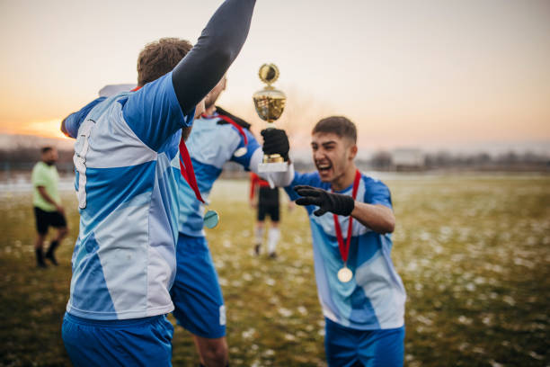 istock Football team won a trophy 1360011010