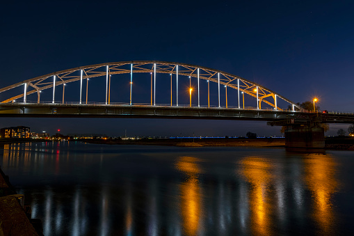 The Wilhelmina bridge at the river IJssel near Deventer in the Netherlands at night
