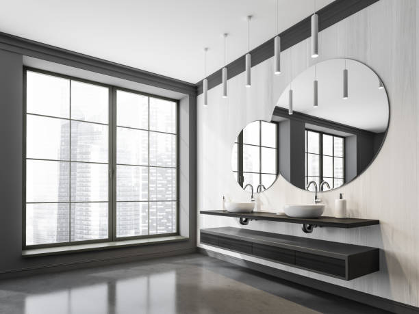 istock Creative bathroom mirror on white wood wall. Corner view. 1360012006