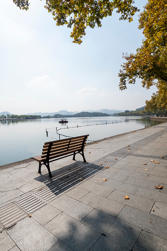 Empty bench by the West Lake in Hangzhou, China
