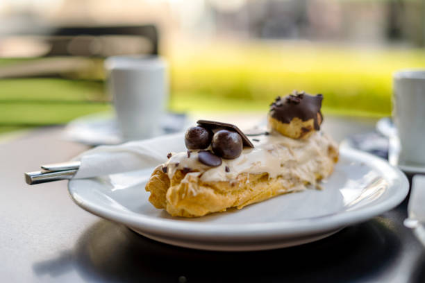 Tasty eclair pastry filled and covered  with chocolate