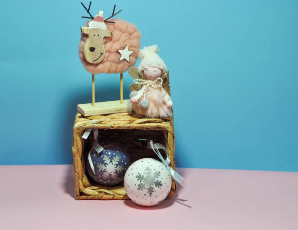 istock Beautiful new year's ornaments on a blue-pink background 1360016458