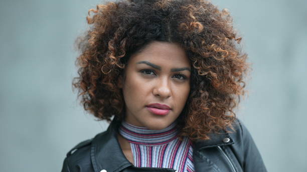istock Portrait hispanic black woman looking at camera 1360016891