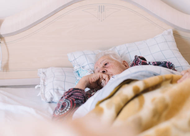 istock old woman at home 1360017871