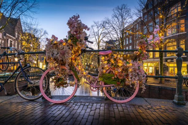 Pink flower bike on a bridge in Amsterdam, Netherlands.LBGTQ