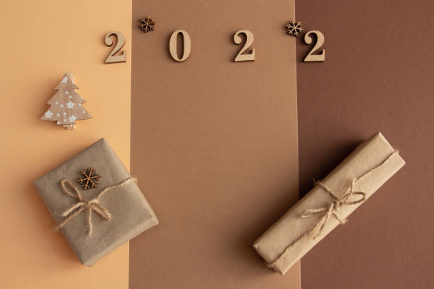 istock 2022, christmas composition on a brown background, gifts, copy space 1360019081