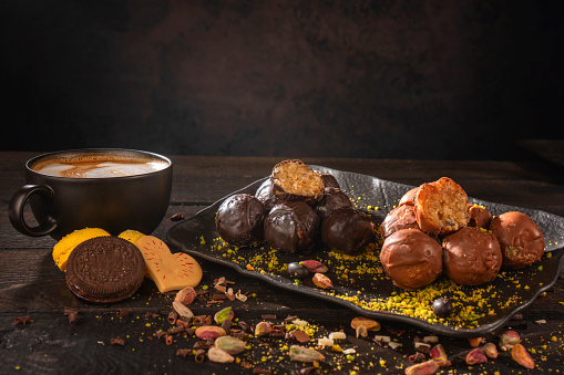 Chocolate truffles with cocoa powder, cinnamon, almonds