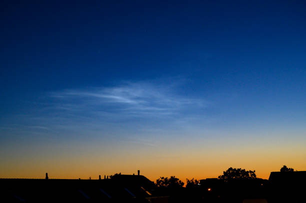 Noctilucent clouds or night shining clouds in the dark night sky