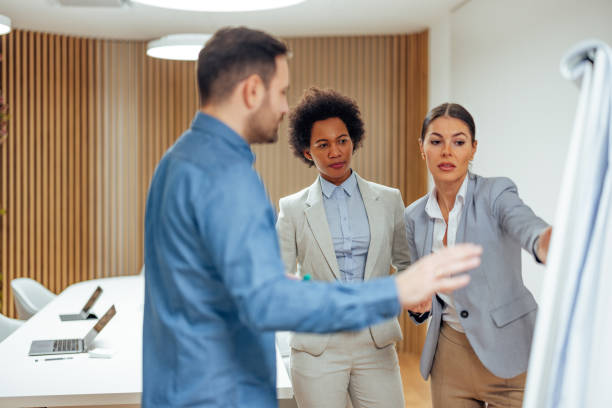istock Hardworking corporate team, looking for ways to improve their product. 1360026840