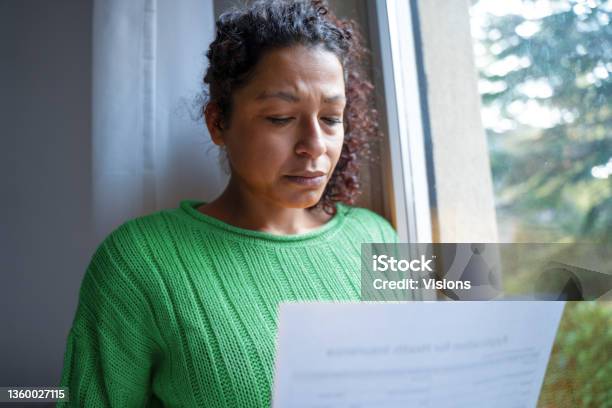 One Black Woman Getting Bad News Feeling Anxiety Stock Photo - Download Image Now - Poverty, Eviction, One Woman Only