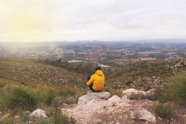 istock Middle-aged person doing activity in nature to achieve objectives. 1360027187