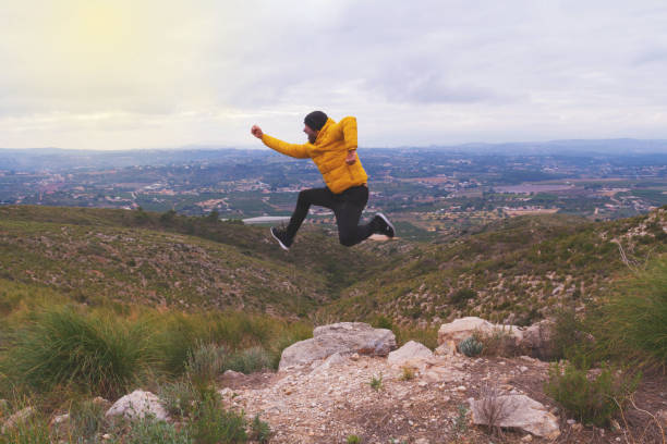 istock Middle-aged person doing activity in nature to achieve objectives. 1360027195