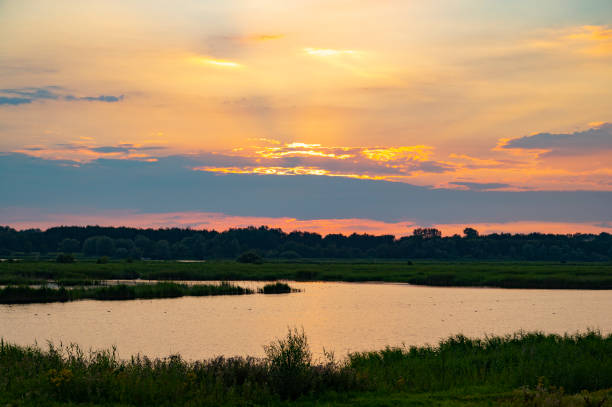 Sunset in the IJsseldelta region at the end of a beautiful summer day in Overijssel.