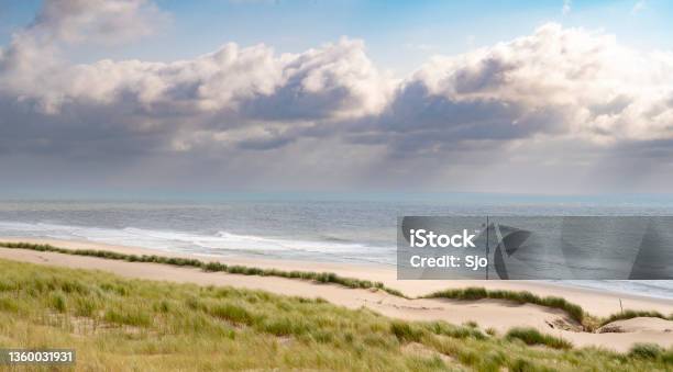 Summer In The Dunes With Clouds Drifting Over The Sea Stock Photo - Download Image Now