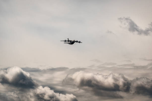 istock military plane in the sky 1360031972
