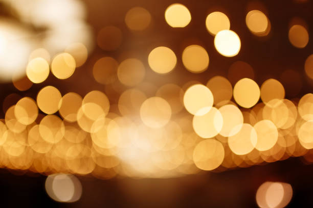 istock Christmas gold background. Festive abstract background with bokeh defocused lights 1360032613