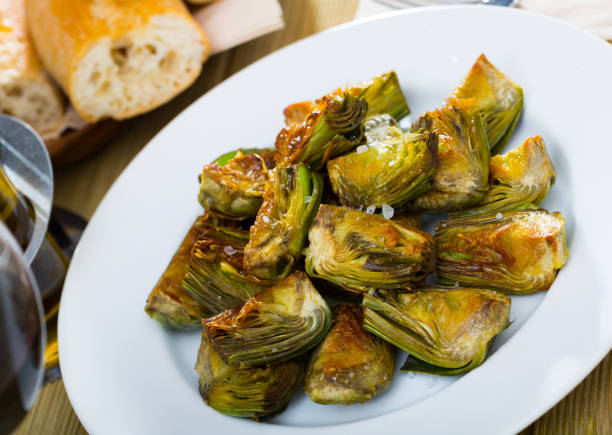 istock Sauteed in oil artichokes 1360034585