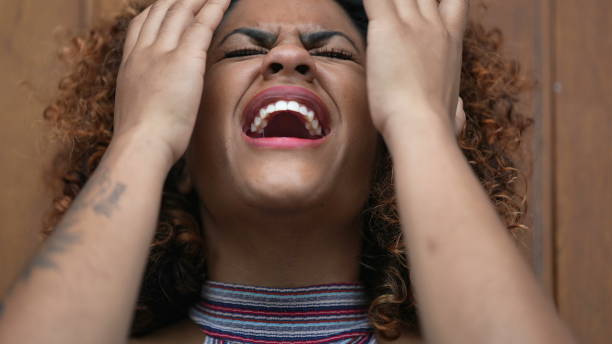 istock Woman covering face with hand feeling worry and preoccupation 1360036131