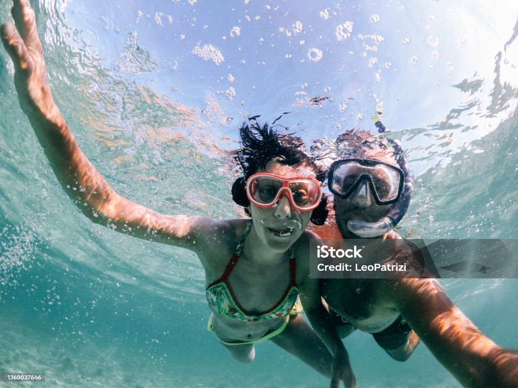 Woman swimming in Mauritius Woman swimming in the beautiful sea of Mauritius protected by the reef on the Indian Ocean Mauritius Stock Photo