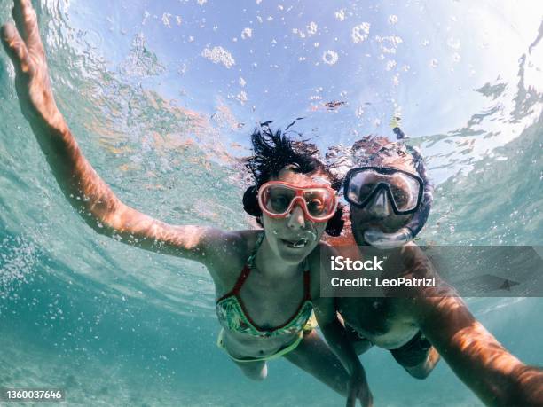 Woman Swimming In Mauritius Stock Photo - Download Image Now - Mauritius, Couple - Relationship, Tropical Climate