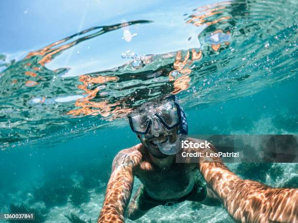Man Snorkeling On Vacation Stock Photo - Download Image Now - Snorkeling, Snorkel, Mauritius