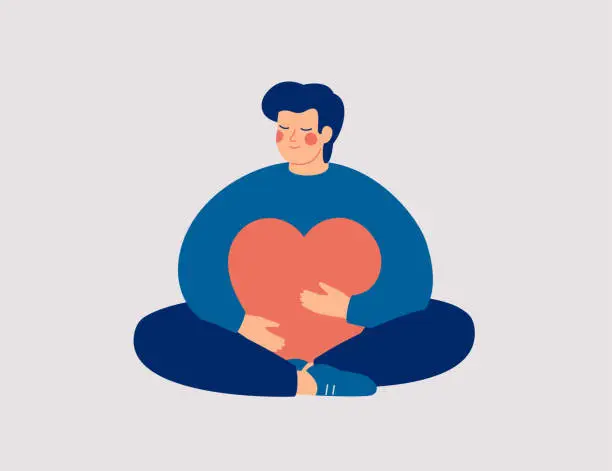 Vector illustration of Young man embraces a big red heart with mindfulness and love. Smiling boy sits in lotus pose with closed eyes and enjoys his freedom and life.