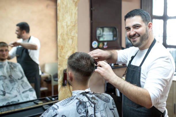 istock Barber working in his shop 1360039545