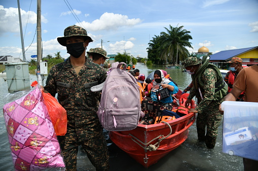 The members of Malaysian Armed Forces help evacuated the flood victims at RTB Bukit Changgang, Dengkil, Sepang on December 20th, 2021.