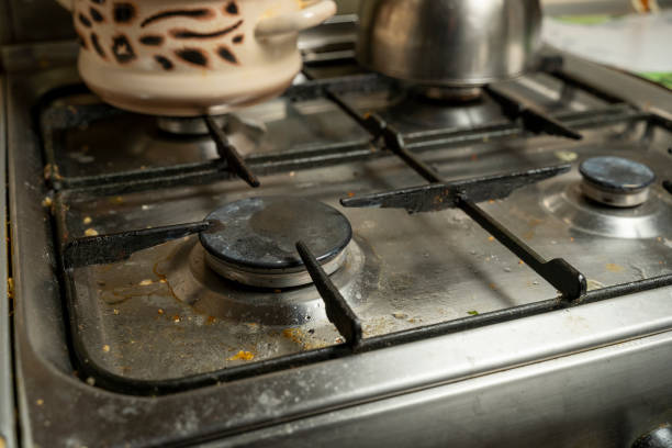istock Dirty gas stove in the kitchen with kitchen utensils 1360042697