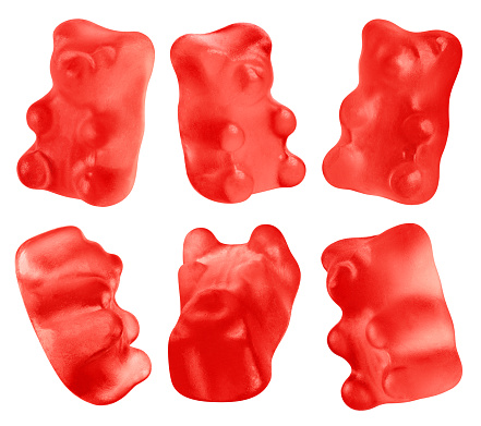 Collection of red jelly gummy bears, isolated on white background
