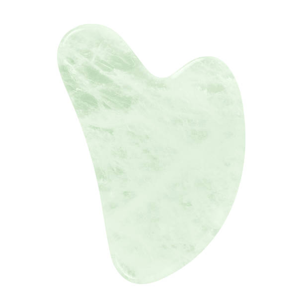 raspador verde gua sha, ferramenta de massagem isolada em fundo branco. - spooning - fotografias e filmes do acervo