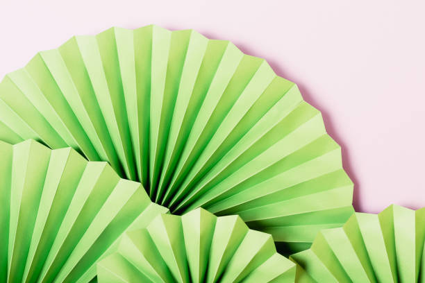 istock Festive background with green paper 1360059175