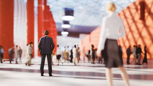 istock Businessman standing in crowds of office workers 1360059396