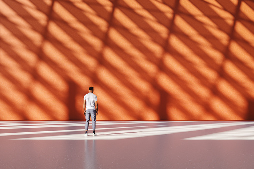 Casual man standing in big empty office lobby. This is entirely 3D generated image.