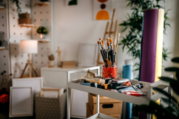 istock Art table with paint brush and tubes 1360060543
