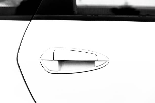 istock Door handle of a white car 1360061605
