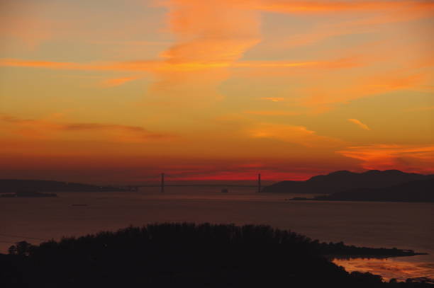 San Francisco Bay Area Sunset with ship passing  as seen from East Bay