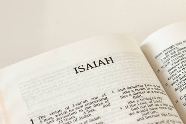 Open Holy Bible Isaiah prophet Book Old Testament Scripture on white background. Christian biblical concept of prophecy, trust, and faith in God Jesus Christ stock photo