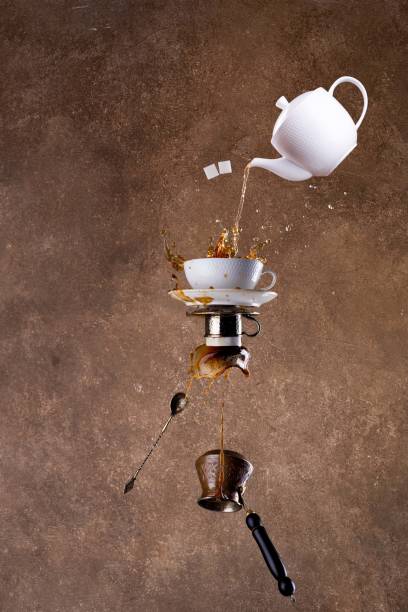 istock Levitation coffee and tea splashes on brown background 1360068352