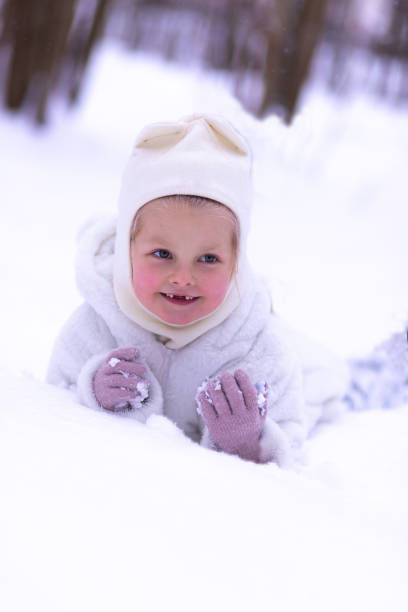 istock A girl laying in snow 1360069498