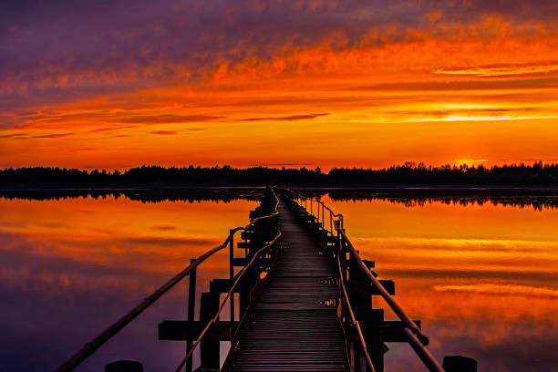 istock old iron footbridge on the lake at sunset 1360069587