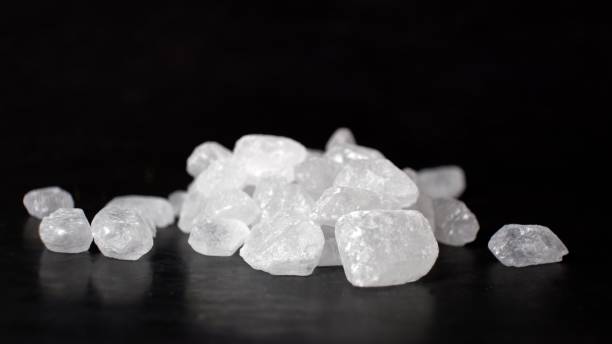 istock White rock candy looks like crystals or gemstones on a dark background 1360070804
