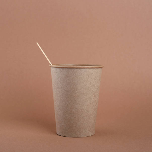 istock Disposable kraft paper cup and wooden coffee stick 1360073268