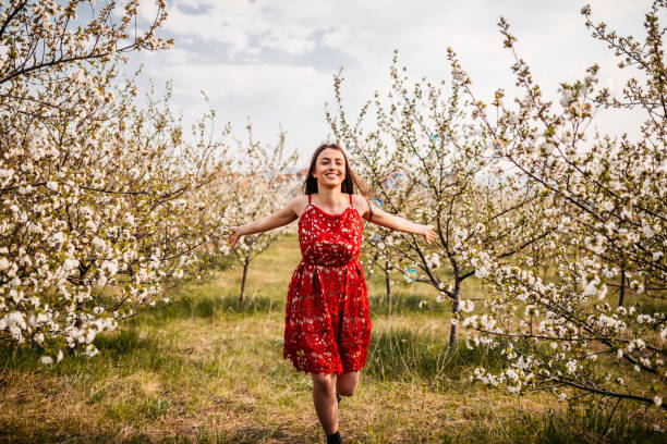 istock Young Woman In The Garden 1360075301