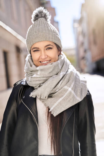 istock Merry young female in knitted hat 1360084212