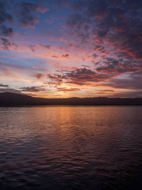 istock Colorful sunset with dramatic sky clouds over Knysna lagoon 1360085034