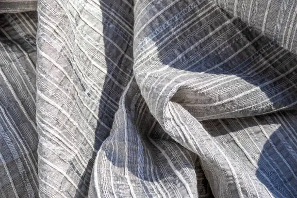 Photo of Textured  linen fabric. Silver-Gray monochrome texture