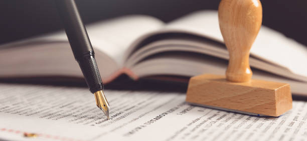 istock Agreement concept with fountain pen and documents 1360087861